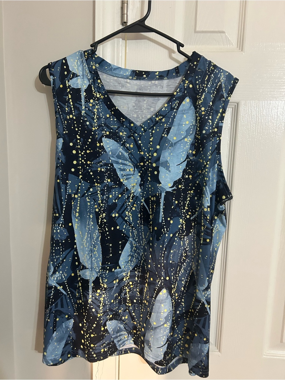 Sleeveless V-Neck Top with Blue Feather Print